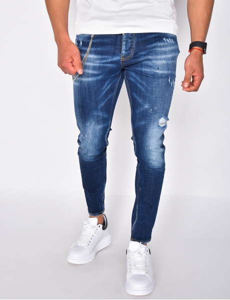 Jeans with paint-style flecks and chain